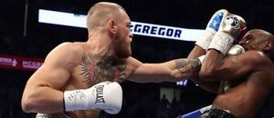 Conor McGregor ve slavném boxerském zápase s Floydem Mayweatherem Conor McGregor ve slavném boxerském zápase s Floydem Mayweatherem